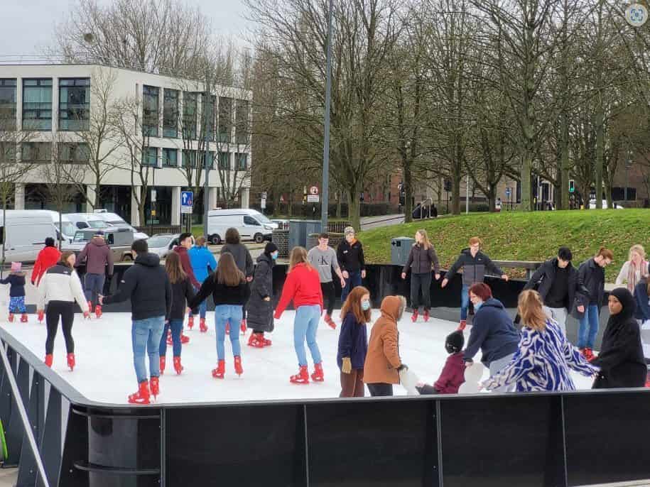 people enjoying ice magic synthetic ice rink